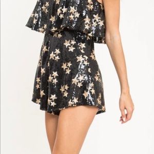 BRAND NEW AT PIECE STAR SEQUIN ROMPER SIZE MEDIUM.